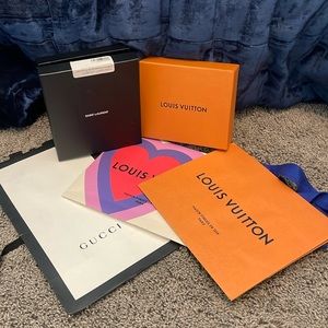 2 Louis Vuitton shopping bags 1 Gucci shopping bag. 1 Louis Vuitton Box 1 SL box